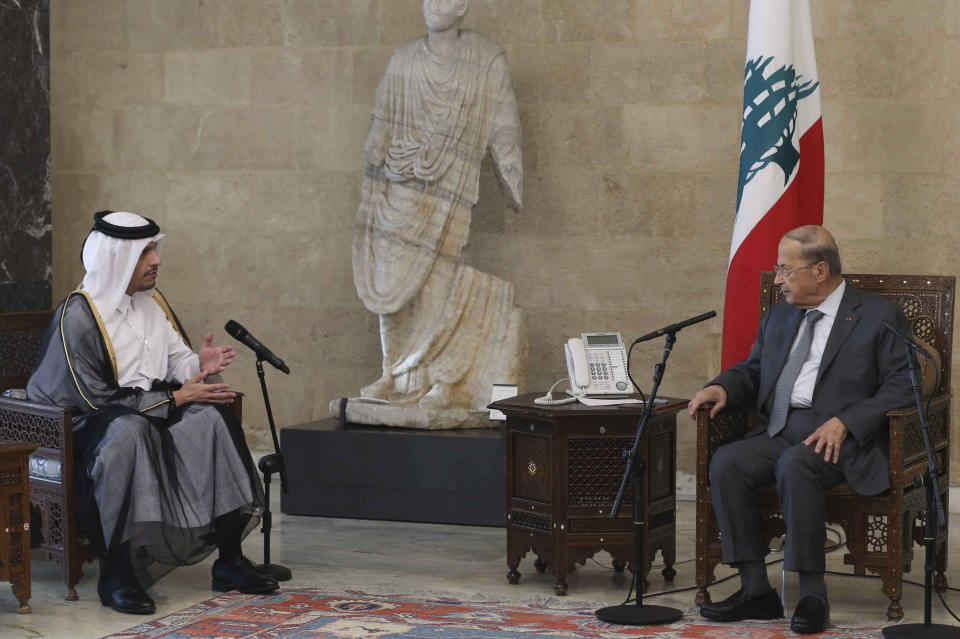 In this photo released by Lebanon's official government photographer Dalati Nohra, Lebanese president Michel Aoun, right, meets with Qatar's Deputy Prime Minister and Foreign Minister Sheikh Mohammed bin Abdulrahman bin Jassim Al-Thani, at the presidential palace, in Baabda, east of Beirut, Lebanon, Tuesday, July 6, 2021. Qatar's Foreign Minster is in Beirut for one day visit to meet with Lebanese officials and the Lebanese Army Commander Gen. Joseph Aoun. (Lebanon Government /Dalati Nohra via AP)