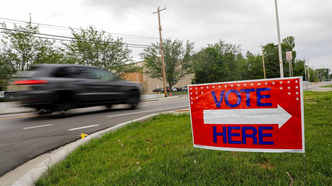 A vehicle drives past a sign outside Clays Mill Elementary school on May 16, 2023, as Kentucky went the polls on primary election day. Workers at this precinct said they had 40 people vote in the first two hours the polls were open. Brian Simms/bsimms@herald-leader.com