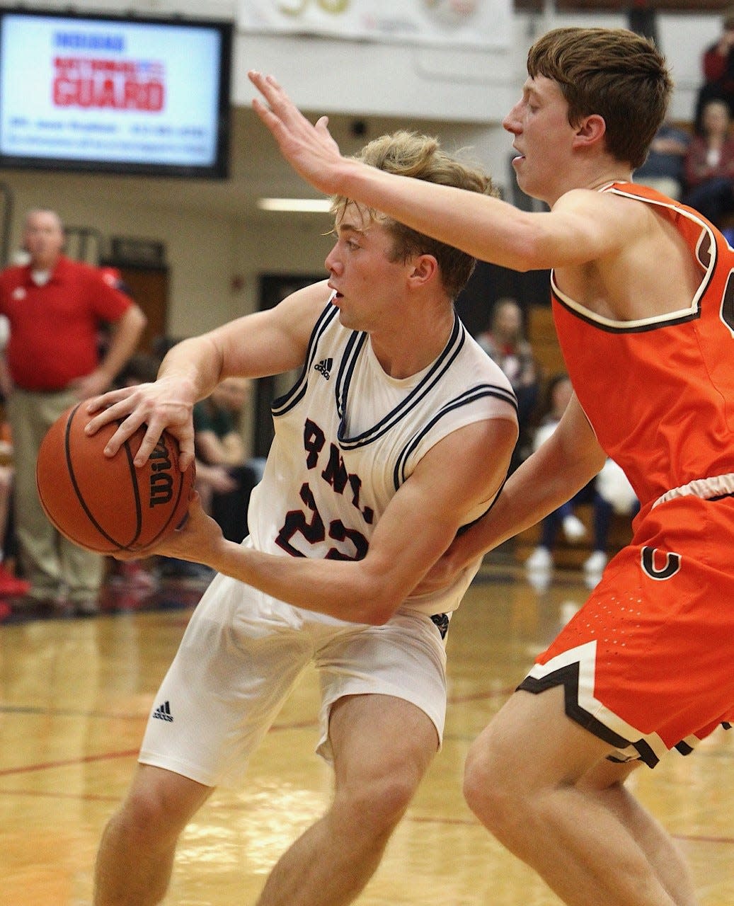 BNL junior guard Colton Staggs dives and dishes against Columbus East Friday night. Staggs scored 12 points in a 50-34 HHC win.