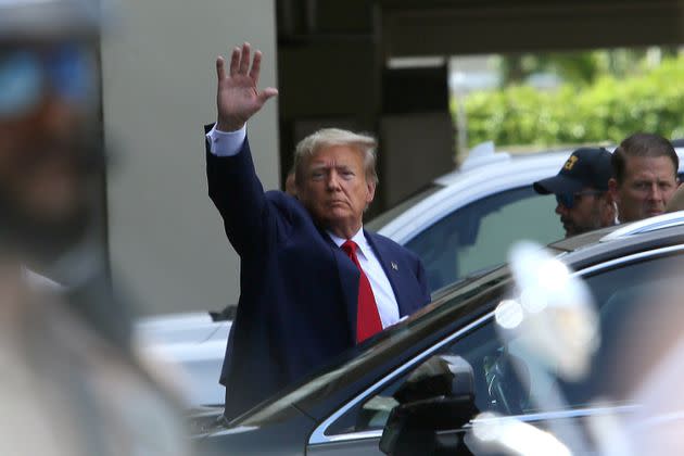 Trump waves as he makes a visit to the Cuban restaurant Versailles after he appeared for his arraignment in Miami. 