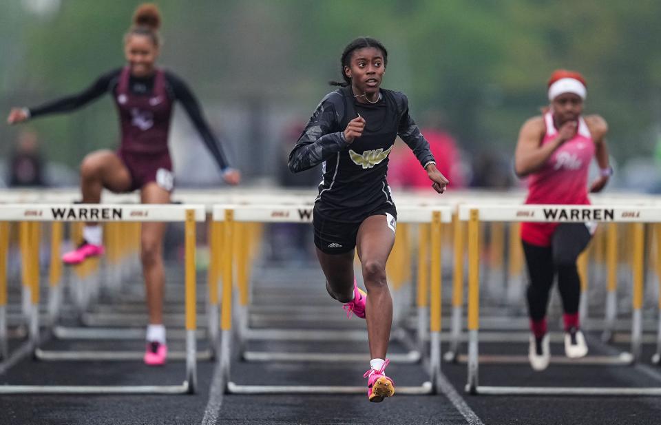 Warren Central's Laila Smith competes in the 100 meter hurdles during the MIC Outdoor Championship on Friday, April 28, 2023 at Warren Central High School in Indianapolis. 