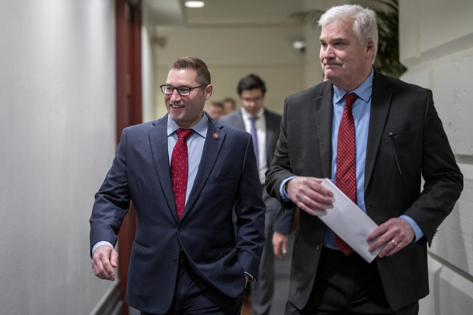 FILE - Rep. Guy Reschenthaler, R-Pa., left, the incoming chief deputy whip for House Republicans, walks with Rep. Tom Emmer, R-Minn., the incoming House majority whip, as they arrive for a closed-door Republican Conference meeting at the Capitol in Washington, Jan. 3, 2023, opening day of the 118th Congress. (AP Photo/J. Scott Applewhite, File)