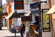 Boards displaying the exchange rate of the Mexican peso against the U.S. dollar are pictured outside exchange houses in Ciudad Juarez