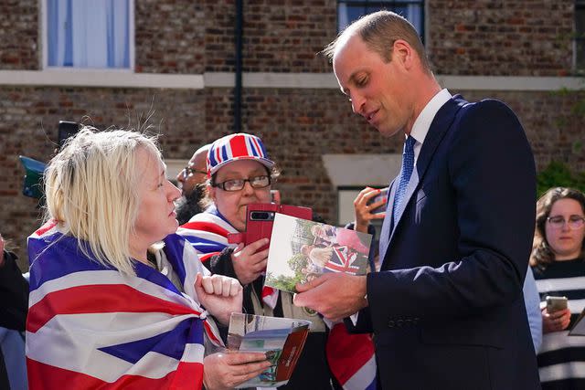 <p>Ian Forsyth/Getty</p> Prince William speaks with well wishers after he visits James' Place Newcastle on April 30, 2024