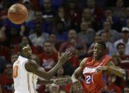 Dayton guard Jordan Sibert (24) and Florida forward Dorian Finney-Smith (10) watch a passed ball during the first half in a regional final game at the NCAA college basketball tournament, Saturday, March 29, 2014, in Memphis, Tenn. (AP Photo/Mark Humphrey)