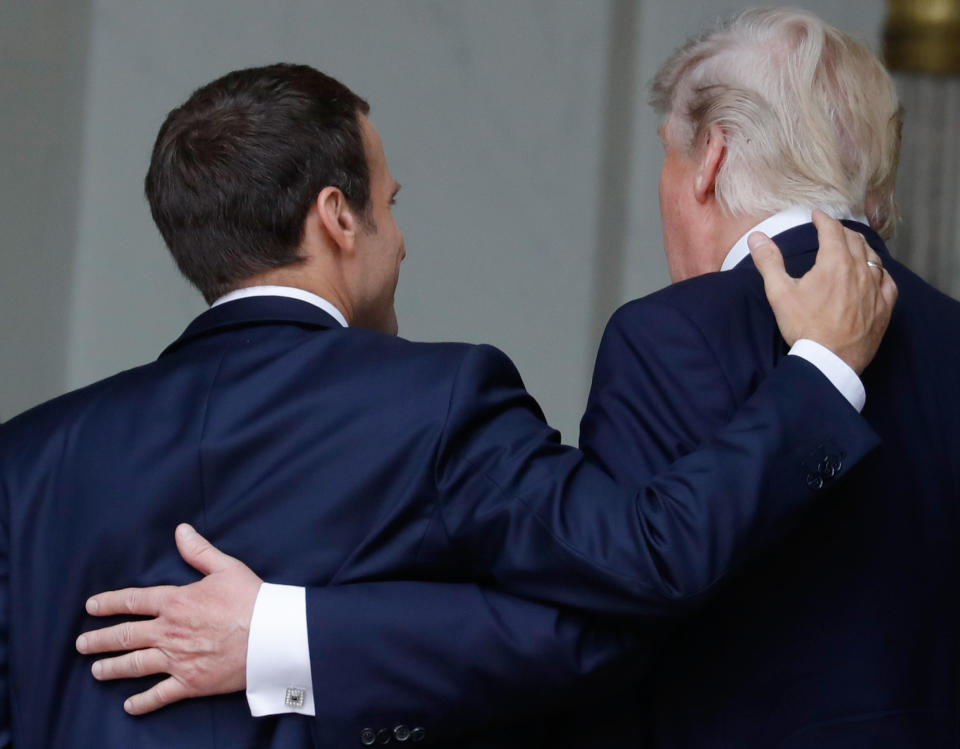 French President Emmanuel Macron shares a laugh with Trump as they arrive at the Elysee Palace.&nbsp;