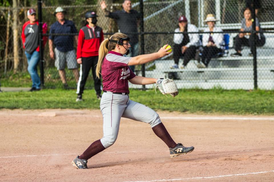 Harrison's Gabriella Triano winds up for a pitch.