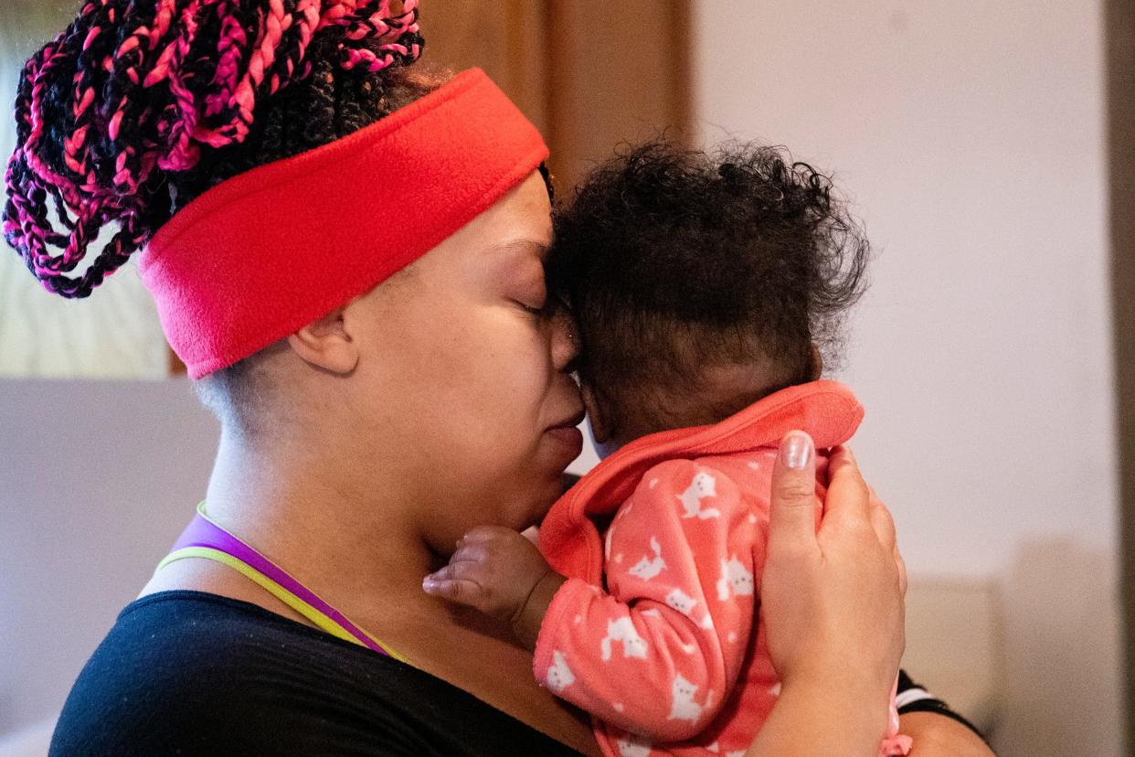 Nickeatrice McDowell holds her daughter Faith Cook close to her in the kitchen of her apartment on Wednesday, November 15, 2022, in Jackson, Tenn. "Since I got all girls, I changed everything about myself,” McDowell said. “Now I'm going to help them be the best person they can be. Because I want nothing but the best for them. The best."