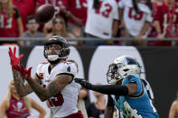 Tampa Bay Buccaneers wide receiver Mike Evans scores in front of Carolina Panthers cornerback CJ Henderson during the second half of an NFL football game between the Carolina Panthers and the Tampa Bay Buccaneers on Sunday, Jan. 1, 2023, in Tampa, Fla. (AP Photo/Chris O'Meara)