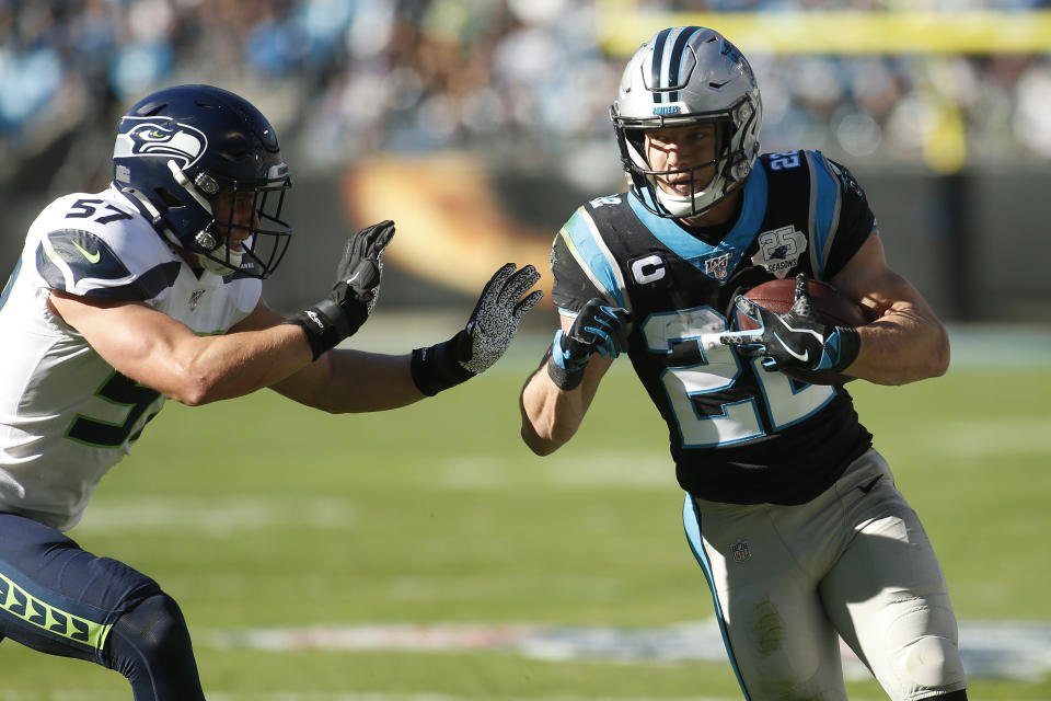 Seattle Seahawks linebacker Cody Barton (57) chases Carolina Panthers running back Christian McCaffrey (22) during the first half of an NFL football game in Charlotte, N.C., Sunday, Dec. 15, 2019. (AP Photo/Brian Blanco)