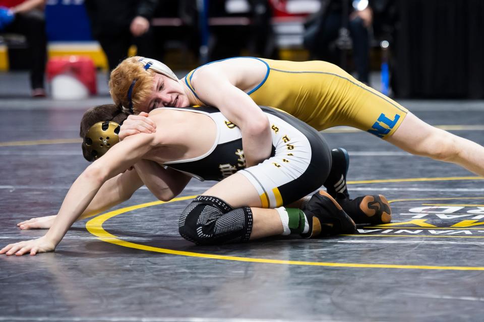 Northern Lebanon's Aaron Seidel (top) scores on his way to a gold medal against Bishop McDevitt's Greyson Music at the state championships. Music is a Lebanon County native.
