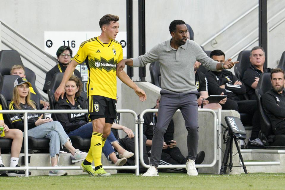 Columbus Crew coach Wilfried Nancy, right, speaks with Malte Amundsen during the first half of the team's MLS soccer match against CF Montréal on Saturday, April 27, 2024, in Columbus, Ohio. (AP Photo/Jeff Dean)