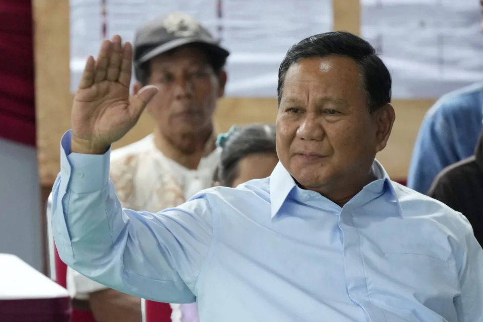 Indonesian presidential candidate Prabowo Subianto checks his ballot during the election in Bojong Koneng, Indonesia, Wednesday, Feb. 14, 2024. Defense Minister Subianto, a wealthy ex-general with ties to both Indonesia’s popular outgoing president and its dictatorial past looks set to be its next president, after unofficial tallies showed him taking a clear majority in the first round of voting.(AP Photo/Vincent Thian)