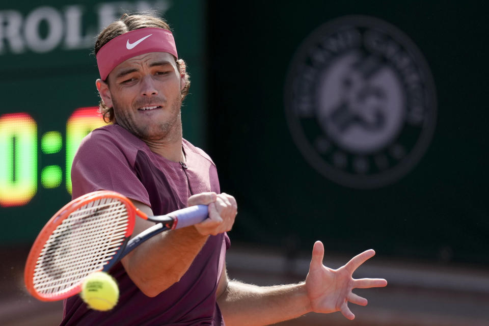 Taylor Fritz of the U.S. plays a shot against Michael Mmoh of the U.S. during their first round match of the French Open tennis tournament at the Roland Garros stadium in Paris, Tuesday, May 30, 2023. (AP Photo/Christophe Ena)