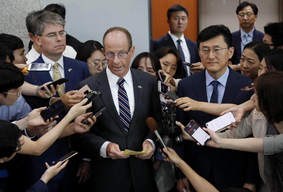 David Stilwell, center left, U.S. Assistant Secretary of State for the Bureau of East Asian and Pacific Affairs, speaks as South Korea's Deputy Foreign Minister for Political Affairs Yoon Soon-gu, center right, listens after a meeting with South Korean Foreign Minister Kang Kyung-wha at the foreign ministry in Seoul, South Korea, Wednesday, July 17, 2019. (AP Photo/Ahn Young-joon. Pool)