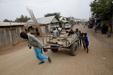 A man pulls a cart in the Kakuma refugee camp in northern Kenya, March 6, 2018. REUTERS/Baz Ratner
