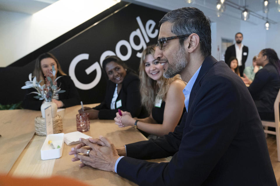 Google CEO Sundar Pichai talks with college students during a workshop at the Google office in Washington, Thursday, June 22, 2023. (AP Photo/Jose Luis Magana)