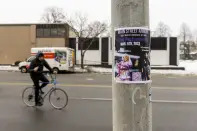 A flyer for Kream Kalari and GloRilla hangs on a post outside of the Main Street Armory on Monday, March 6, 2023, in Rochester, N.Y. (AP Photo/Lauren Petracca)