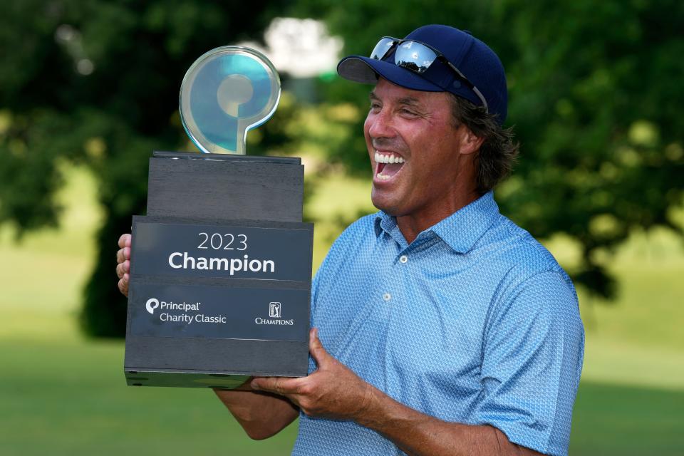 Stephen Ames holds the trophy after winning the Champions Tour Principal Charity Classic golf tournament on Sunday in Des Moines.