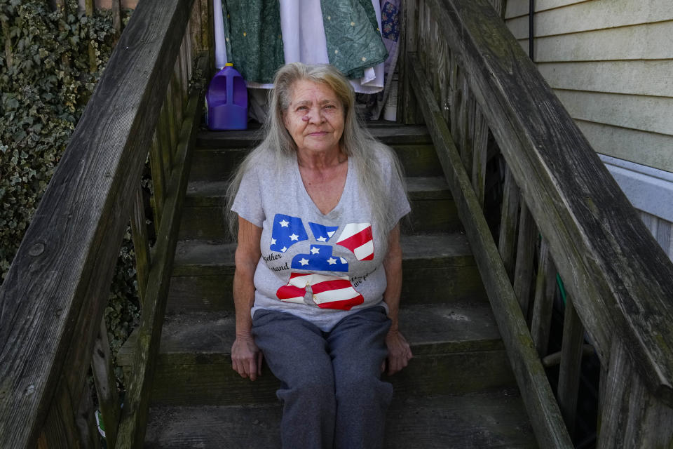 Lanette Clendaniel, mother of Sarah Beth Clendaniel, poses for a photograph for The Associated Press outside her home, Wednesday, Feb. 8, 2023, in North East, Md. U.S. Attorneys for Maryland announced the arrests and a federal criminal complaint charging Sarah Beth Clendaniel, of Catonsville, and Brandon Clint Russell, of Orlando, with conspiracy to destroy an energy facility. (AP Photo/Julio Cortez)