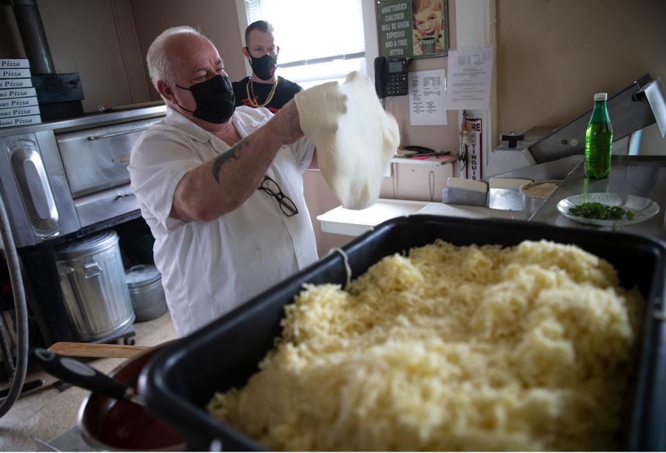 Lou Chiafullo is shown in 2021 making pizza at his family's Long Branch restaurant, Nunzio's Pizzeria and Italian Restaurant.