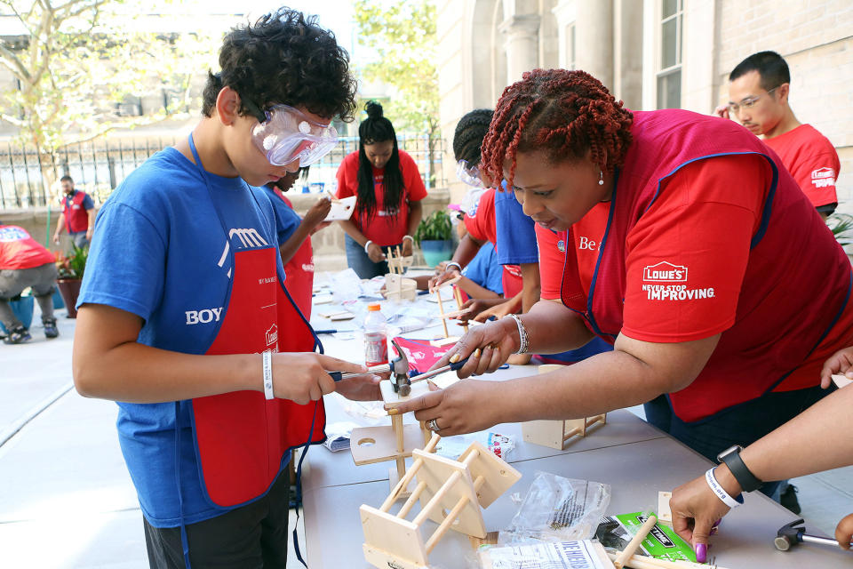 Lowe's Heroes volunteers join Boys & Girls Club of Harlem kids and teens to work on a club renovation in 2016 in New York. (Krista Kennell/AP Images for Boys & Girls Clubs of America)