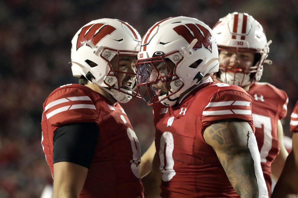 Wisconsin's Braelon Allen celebrates with Tanner Mordecai after scoring a touchdown during the second half of an NCAA college football game against Nebraska Saturday, Nov. 18, 2023 in Madison, Wis. (AP Photo/Aaron Gash)