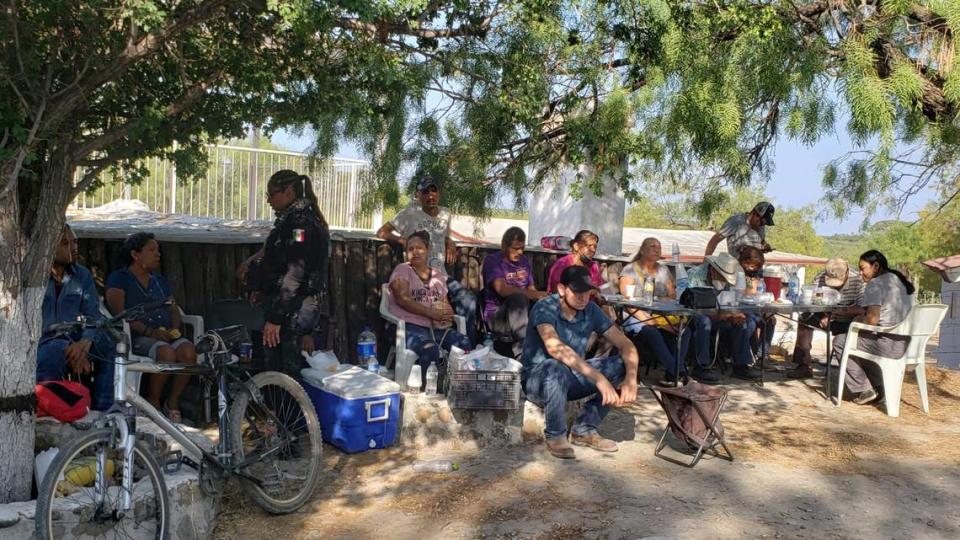 Relatives of miners who are trapped in a collapsed and flooded coal mine wait for information outside the mine in Sabinas in Mexico’s Coahuila state, Thursday, Aug. 4, 2022. The collapse occurred on 10 miners after they breached a neighboring area filled with water on Wednesday, officials said. (AP Photo/Elizabeth Monroy)