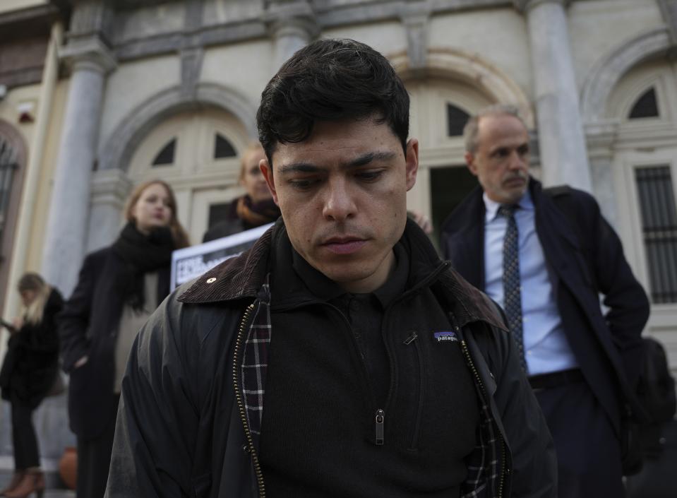 Sean Binderm, one of 24 aid workers and volunteers accused of participating in migrant rescue operations, leaves a court in Mytilene, on the northeastern Aegean island of Lesbos, Greece, Friday, Jan. 13, 2023. The trial of 24 Greek and foreign aid workers and volunteers who participated in migrant rescue operations has drawn widespread criticism from international human rights groups. (AP Photo/Panagiotis Balaskas)