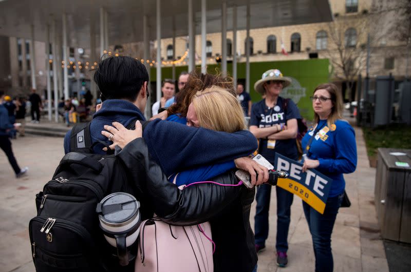 Supporters react to reports of Democratic 2020 U.S. presidential candidate former South Bend, Indiana Mayor Pete Buttigieg suspending his candidacy as they gather before a rally in Dallas