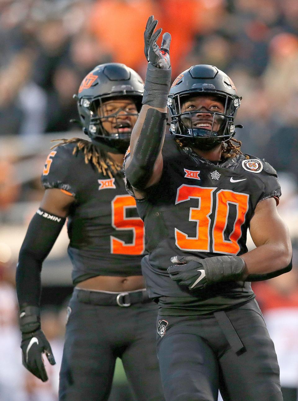 The move to linebacker should elevate Oklahoma State junior Collin Oliver's (30) draft status.