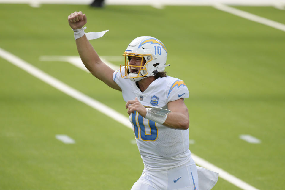 Los Angeles Chargers quarterback Justin Herbert celebrates after throwing his first career touchdown pass during the first half of an NFL football game against the Kansas City Chiefs Sunday, Sept. 20, 2020, in Inglewood, Calif. (AP Photo/Kyusung Gong)