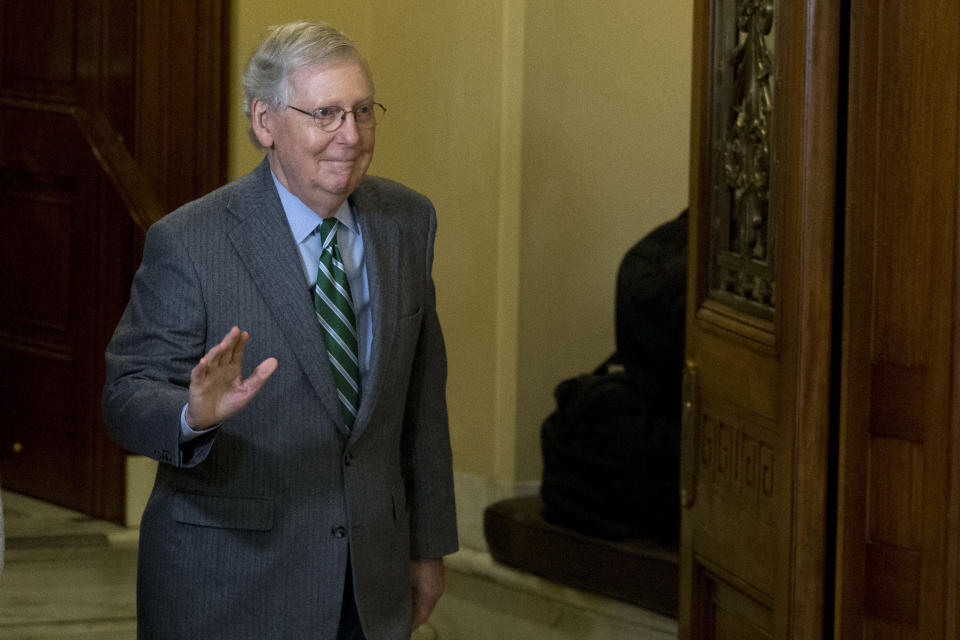 Senate Majority Leader Mitch McConnell, R-Ky., steps out from the Senate chamber on his way to his office, on Capitol Hill in Washington, Thursday, Jan. 16, 2020. (AP Photo/Jose Luis Magana)