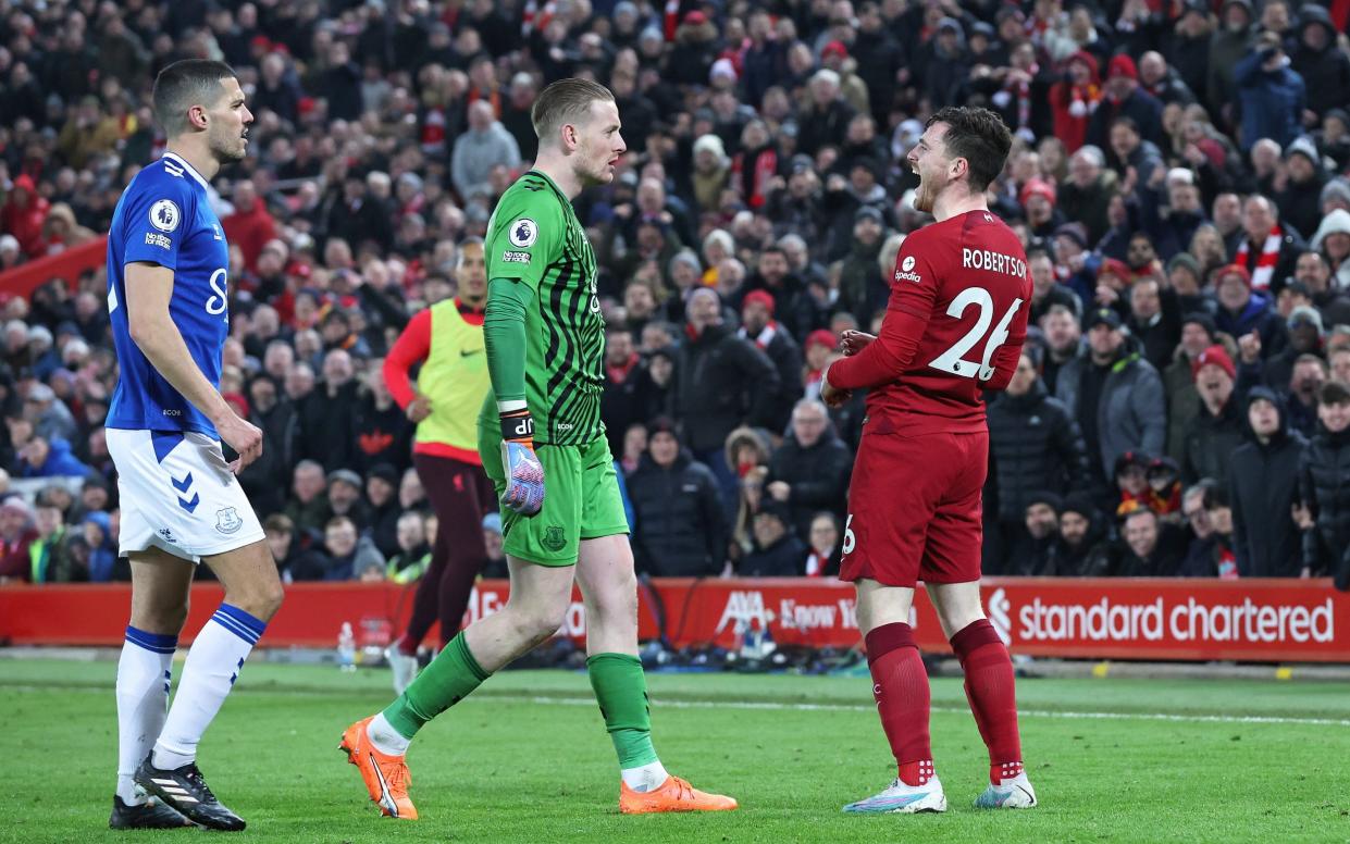 Andy Robertson exchanges words with Jordan Pickford during a 2023 Merseyside derby