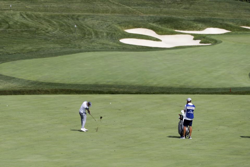 Matthew Fitzpatrick, of England, hits to the 14th green during opening round of the Workday Charity Open golf tournament, Thursday, July 9, 2020, in Dublin, Ohio. (AP Photo/Darron Cummings)