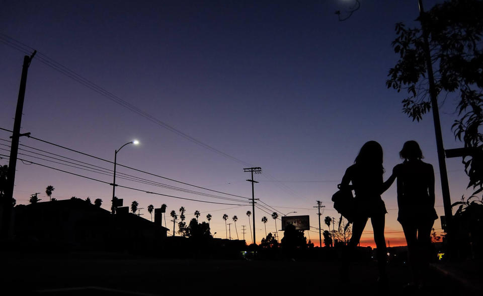 Kitana Kiki Rodriguez and Mickey O'Hagan walk down an LA Street