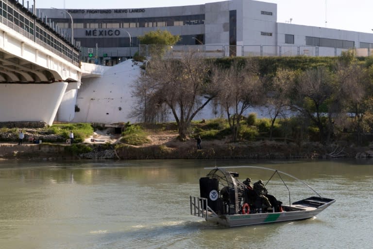 Border Patrol agents cruise the Rio Grande in an air boat in Laredo, Texas