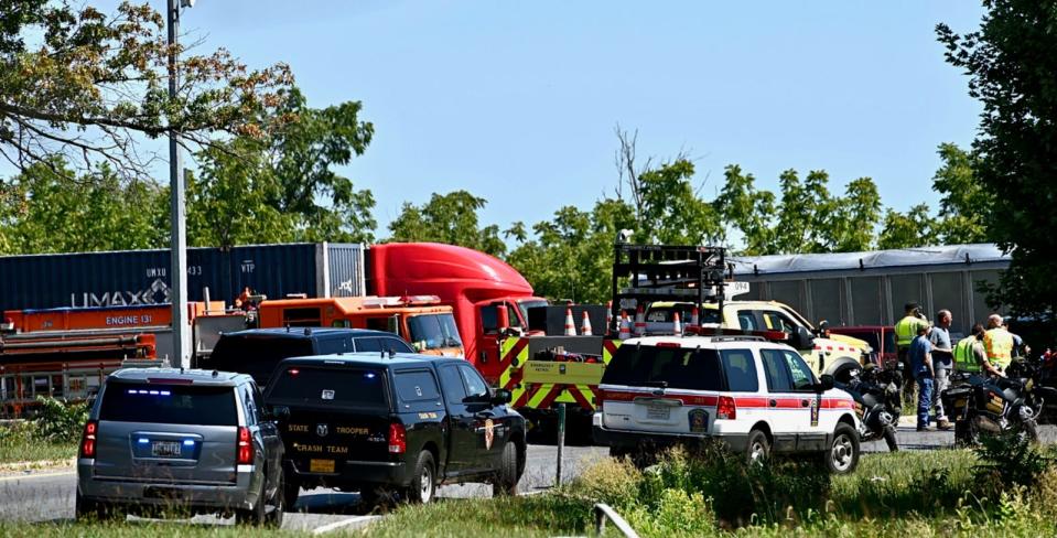 Emergency responders are seen at the site of a deadly crash that involved four tractor-trailers and two passenger vehicles Friday morning on Interstate 81 north of Hagerstown. At least one person was killed and multiple people were injured.