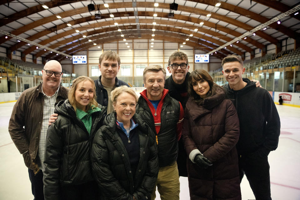 Jayne Torvill and Christopher Dean with some of the Emmerdale cast on an ice rink.