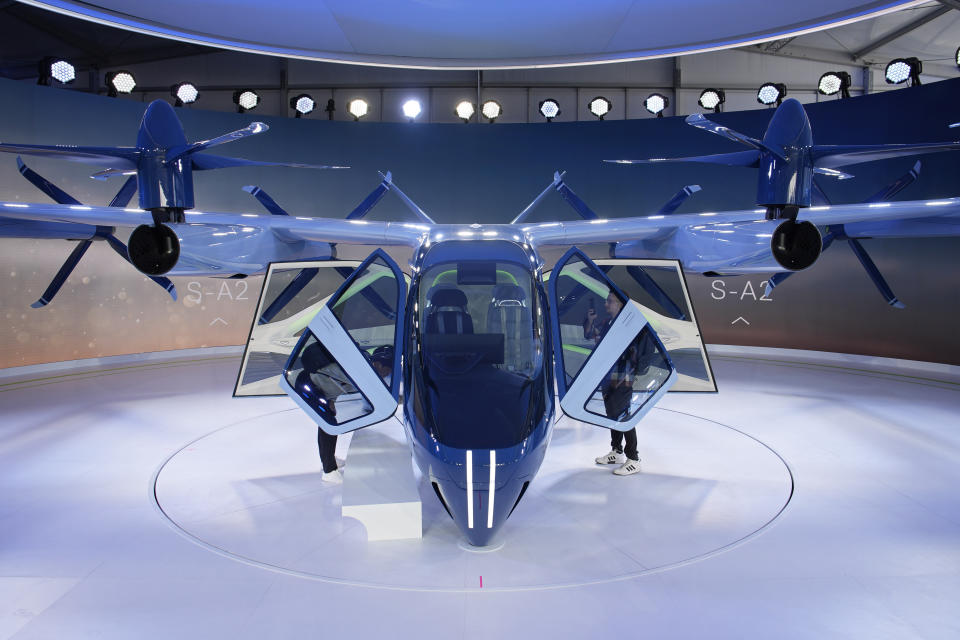 FILE - A person looks at the Supernal S-A2 passenger electric VOTL aircraft at the Supernal booth during the CES tech show Wednesday, Jan. 10, 2024, in Las Vegas. Supernal is a part of the Hyundai Motor Group. (AP Photo/John Locher, File)