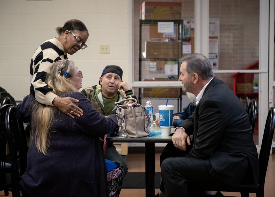 Ohio Attorney General Dave Yost, seated at right, speaks with LaJoyce Harris, program manager of Center of Hope in Ravenna, and some visitors on Thursday, March 7, 2024.