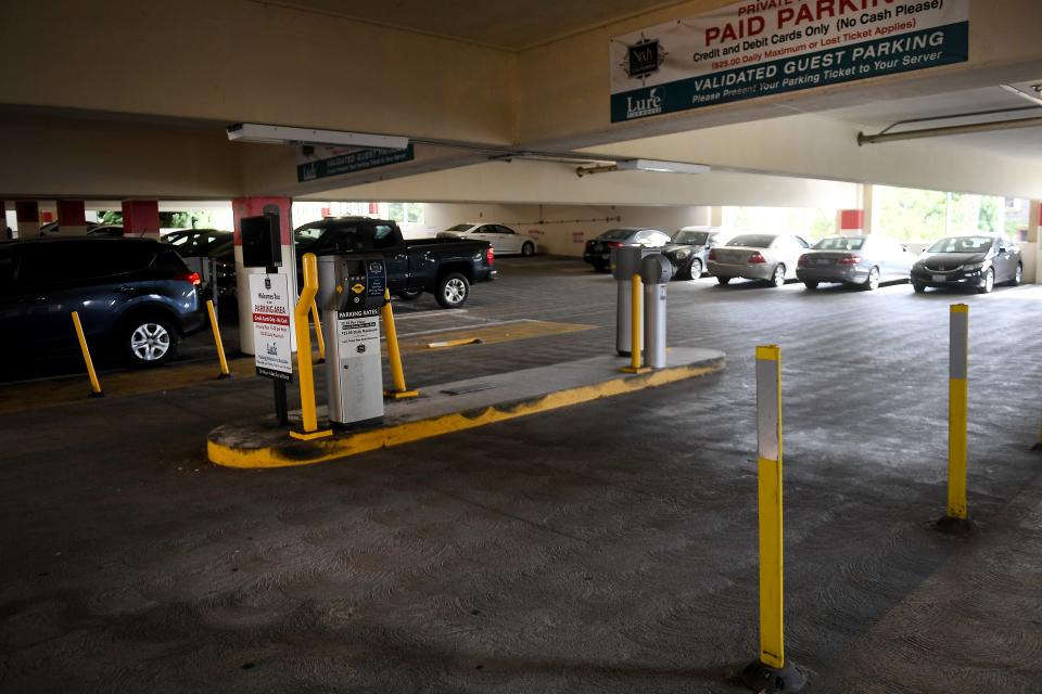 A ticket dispenser marks the entrance to a validated section of the downtown Ventura parking structure on Santa Clara Street.