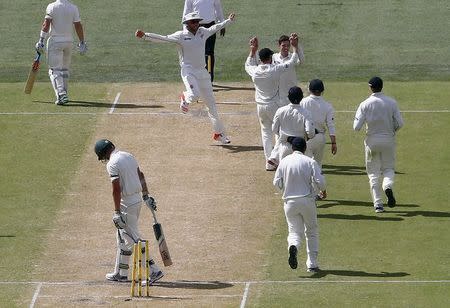 New Zealand's Mitchell Santner (C) celebrates with team mates after bowling Australia's Josh Hazlewood for four runs during the second day of the third cricket test match at the Adelaide Oval, in South Australia, November 28, 2015. REUTERS/David Gray