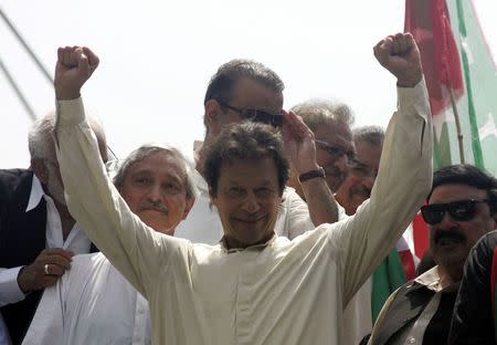 Imran Khan, chairman of Pakistan Tehreek-e-Insaf (PTI) political party, gestures as he leads the Freedom March in Lahore August 14, 2014. REUTERS/Mani Rana