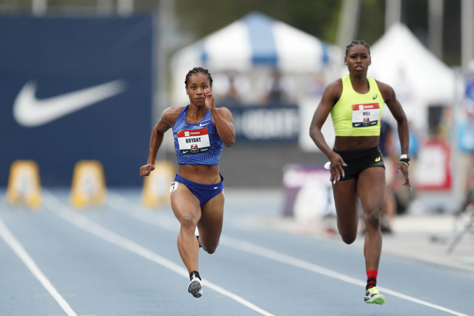 Dezerea Bryant leads Candace Hill, right, sprint during a preliminary heat in the women's 100-meter dash at the U.S. Championships athletics meet, Thursday, July 25, 2019, in Des Moines, Iowa. (AP Photo/Charlie Neibergall)