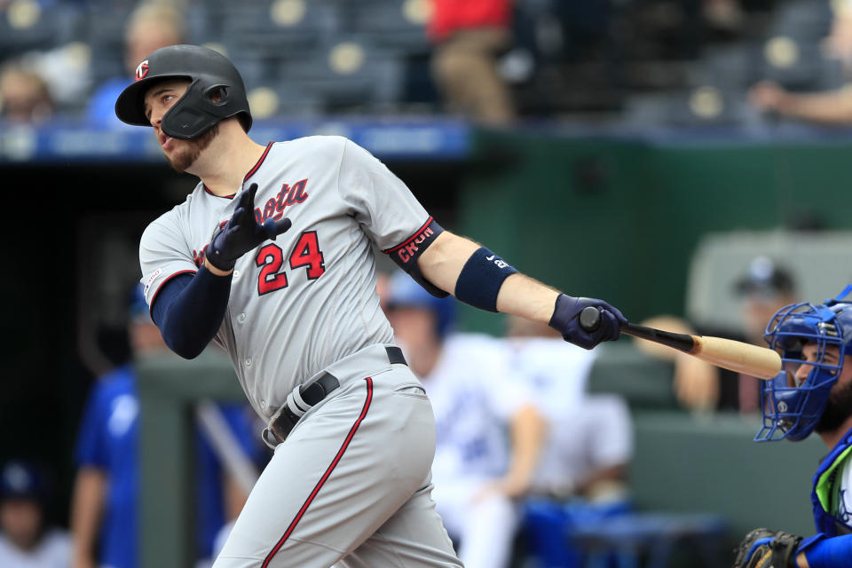 Minnesota Twins' C.J. Cron hits a two-run home run off Kansas City Royals starting pitcher Jorge Lopez during the first inning of a baseball game at Kauffman Stadium in Kansas City, Mo., Sunday, Sept. 29, 2019. (AP Photo/Orlin Wagner)