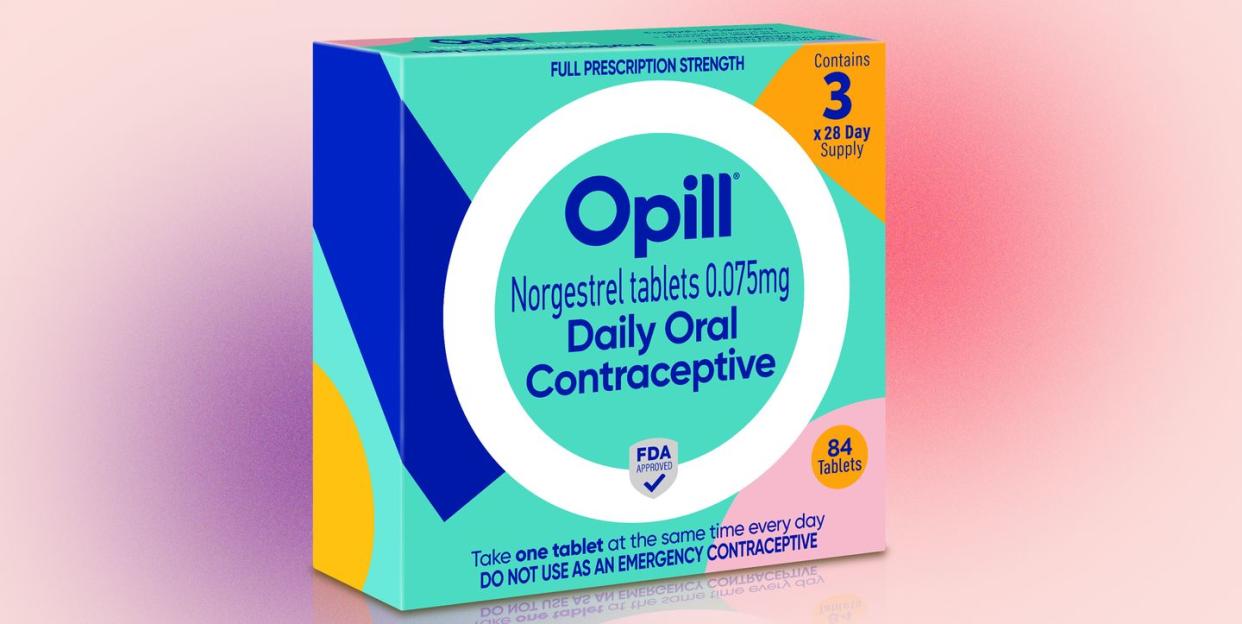 a box of opill set against a pink and purple background