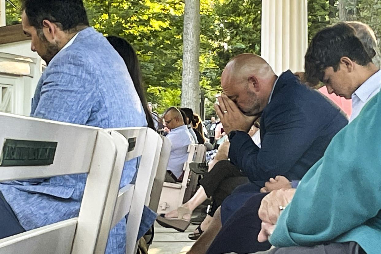 People gather at a vigil pray and observe a moment of silence after an attack on author Salman Rushdie on Aug. 12, 2022, in Chautauqua, New York. <a href="https://newsroom.ap.org/detail/SalmanRushdieAssault/5cbb84f6d2614f56bfa5ee526781bc60/photo?Query=salman%20rushdie&mediaType=photo&sortBy=&dateRange=Anytime&totalCount=394&currentItemNo=25" rel="nofollow noopener" target="_blank" data-ylk="slk:AP Photo/Joshua Goodman;elm:context_link;itc:0;sec:content-canvas" class="link ">AP Photo/Joshua Goodman</a>