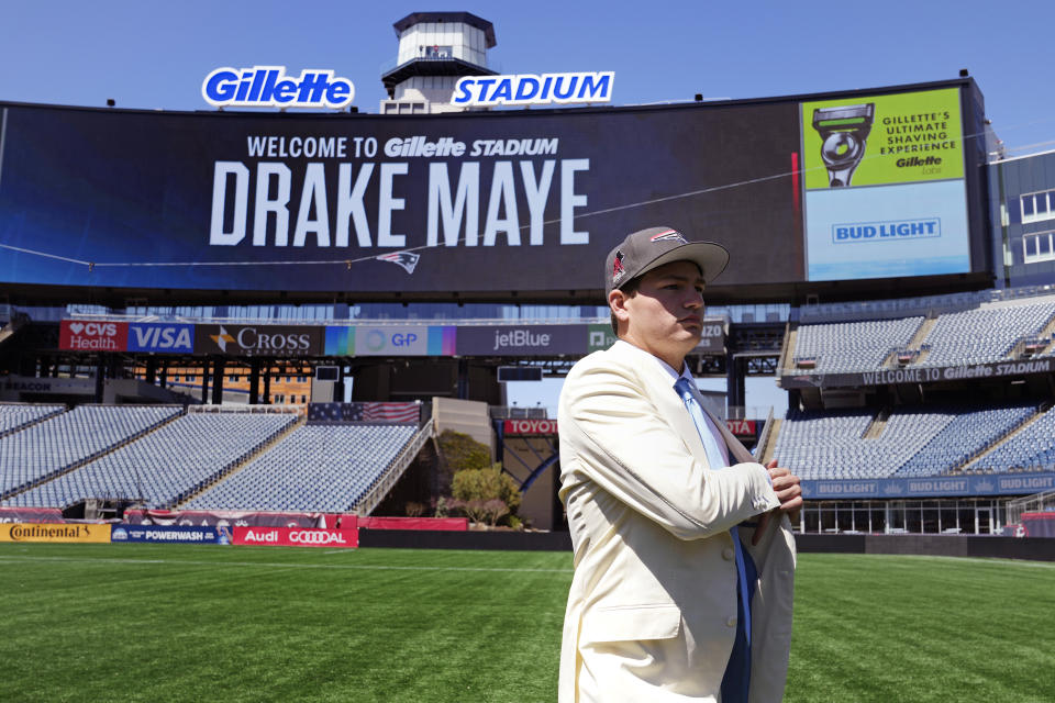 New England Patriots first round draft pick Drake Maye, a quarterback out of North Carolina, walks on the field during an NFL football press conference, Friday, April 26, 2024, in Foxborough, Mass. (AP Photo/Charles Krupa)