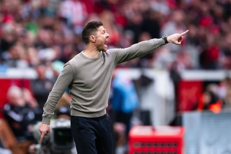 Leverkusen coach Xabi Alonso gestures on the touchline during the German Bundesliga soccer match between Bayer Leverkusen and VfB Stuttgart at the BayArena. Marius Becker/dpa